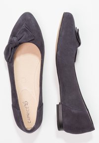 Navy blue suede women's ballet flats with rounded toes, decorative bows, and low black heels, shown from above and side views.