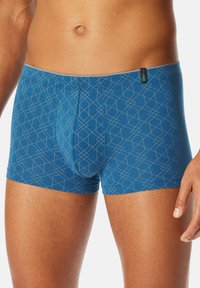 Blue boxer briefs with a geometric pattern in light gray. Features a soft waistband and a snug fit, made from stretchable fabric.