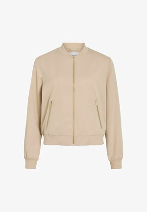 Veste bomber beige clair avec fermeture zippée dorée et poches latérales zippées, poignets et ourlet côtelés.