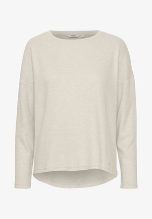 T-shirt long à manches longues beige clair avec un col rond et une coupe décontractée. Tissu doux et texturé avec un ourlet arrondi et un détail de marque discret en bas.