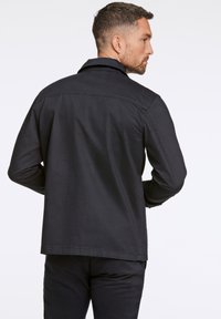Lindbergh SUPERFLEX DYED - Lichte jas - black