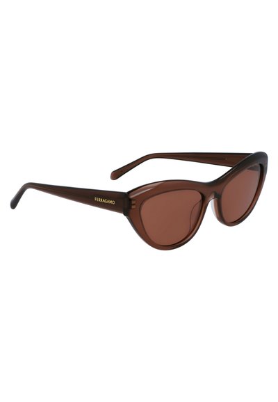 Brown cat-eye sunglasses with a glossy frame, tinted lenses, and gold logo detailing on the temple. Lightweight plastic material.