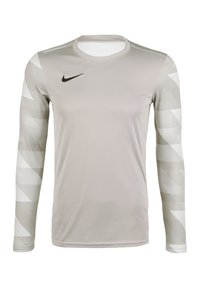 Langärmliges graues Sportshirt mit Rundhalsausschnitt. Verfügt über strukturierte weiße Musterakzente an den Ärmeln und ein kleines schwarzes Nike-Logo.