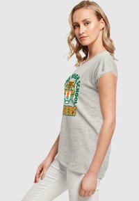 ABSOLUTE CULT STRANGER THINGS - HAWKINS ARCH TIGER  - T-shirts med print - heather grey