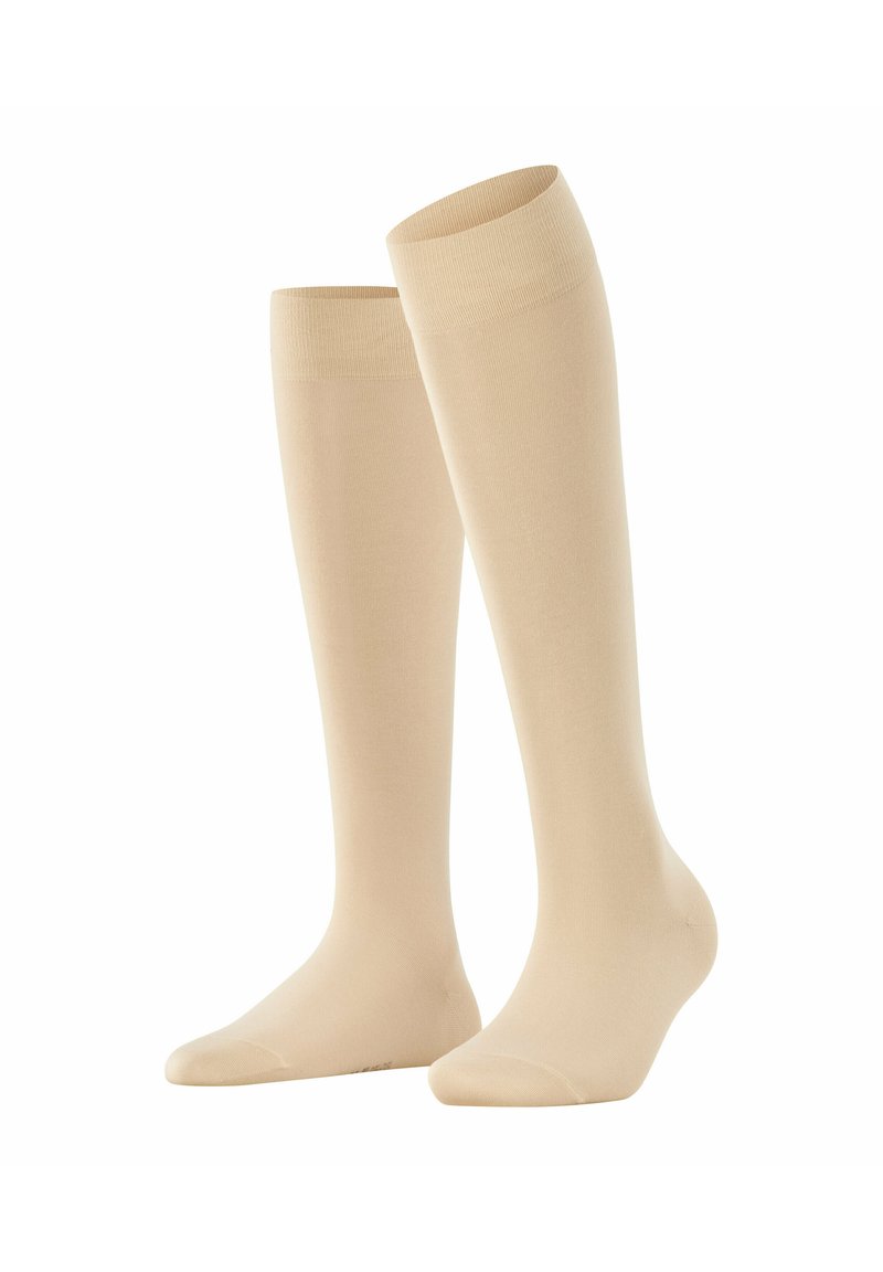 Beige kniehohe Socken aus einem glatten, dehnbaren Material mit einem gerippten Bündchen. Mit verstärkter Zehenpartie und nahtlosem Design.