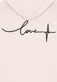 Felpa beige chiaro con cappuccio, caratterizzata da un testo cursivo nero "love" integrato nel design di una linea di battito cardiaco. Tessuto morbido.