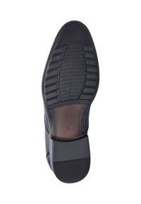 Black leather shoe with a textured rubber sole, featuring a patterned grip and a brown accent on the heel. Size marked as 42.
