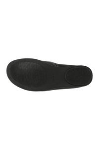 Black shoe sole with textured grip areas on heel and front, displayed flat on a white background.