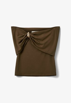 Pruun õlgu paljastav toruüla, millel on keeratud kangasõlm ja kuldse ovaalse rõngaga detail esiküljel keskel.