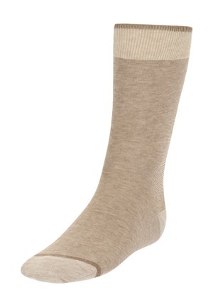 Beige Sock aus einem weichen, strukturierten Stoff. Gerippter Bund und glatter Fuß mit verstärkter Ferse und Zehen, ausgestattet mit einem hellcremefarbigen Akzent.