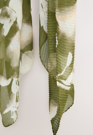 Green patterned scarf made of lightweight fabric, featuring a floral design in shades of cream and soft green with a textured, rippled finish.