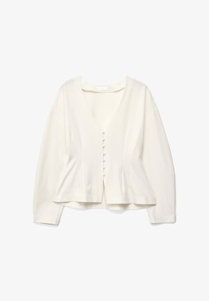 Blusa blanca de tela ligera, con escote en V, mangas largas y cierre frontal con seis botones. Dobladillo plano.