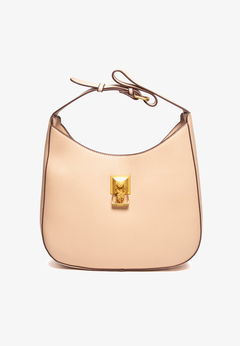 Beige läderhandväska med en böjd form, guldhårdvara på framsidan och ett tunt band. Har en kontrasterande brun kant längs kanterna.