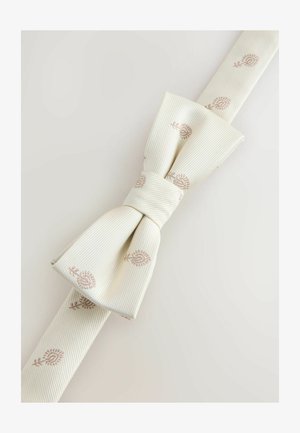 Metuljček iz slonokoščene tkanine z nežnim rjavim cvetličnim vezavi na svetlem ozadju, urejeno in diagonalno zavezano.