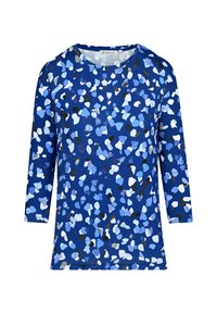 Blaues Oberteil mit einem verstreuten abstrakten Muster in Hellblau, Weiß und Schwarz. Hergestellt aus einem weichen Stoff mit rundem Ausschnitt und drei Viertelärmel.