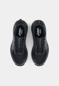 Black athletic shoes featuring a breathable mesh upper, rubber outsole, and subtle branding. Laces and a pull tab are included.