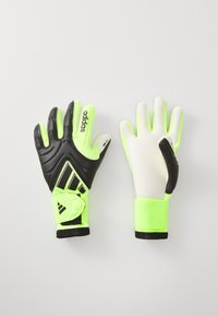 Black and fluorescent green goalkeeper gloves with textured grip, padded black palm, and secure wrist straps. Features Adidas branding.