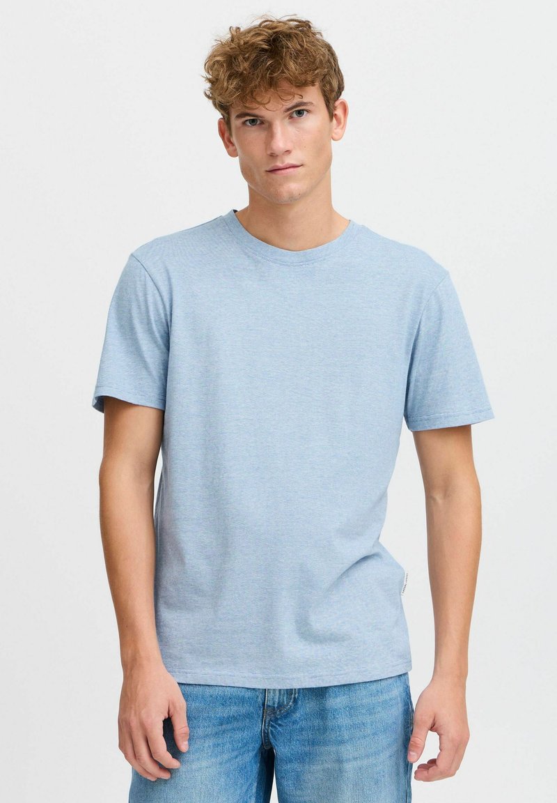 Light blue, short-sleeve T-shirt with a round neck, featuring a subtle stripe pattern and a casual fit. Soft fabric, relaxed design.