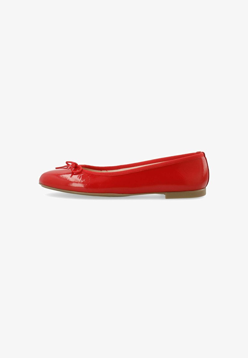 Red patent leather ballet flats with a rounded toe, bow detail on the front, and a low tan rubber sole. Smooth surface texture.