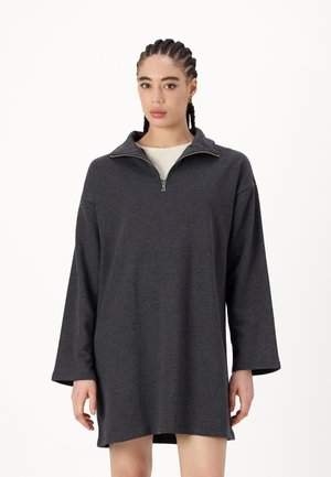 Dark grey pullover dress made from soft fabric, featuring long sleeves and a half-zip collar for adjustable coverage.