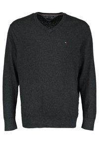 Mörkgrå v-ringad tröja med långa ärmar, ribbade manschetter och nederkant. Har en liten logotyp på bröstet. Tillverkad av ett strukturerat stickat material.