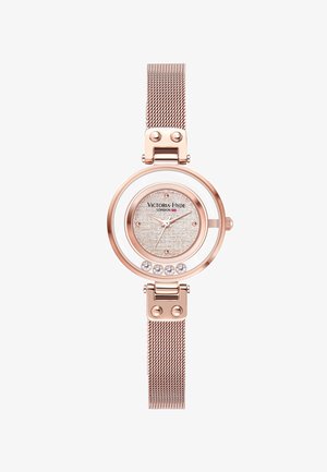 Rose gold mesh-ur med rundt urkasse, hvid bezel, struktureret sølvskive og fem krystal accenter på urskiven. Har en spænde-lukning.