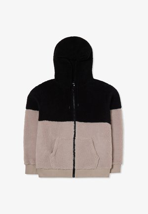 Giacca con cappuccio, con una parte superiore nera e una parte inferiore beige, realizzata in tessuto soffice. Presenta una cerniera frontale e due tasche.