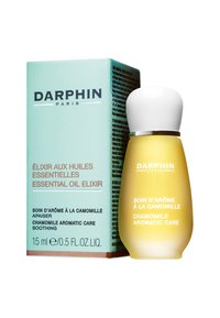 L'Elixir d'Huile Essentielle Darphin dans un petit flacon en verre avec un bouchon blanc. Le flacon est jaune, avec une étiquette de produit en anglais et en français. La boîte est vert menthe.