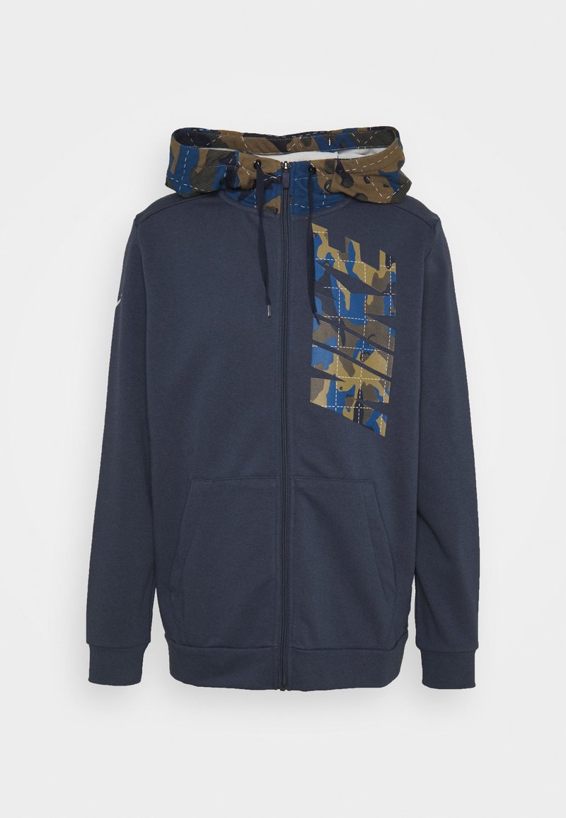 Sweat à capuche zippé bleu marine avec capuche à motif camouflage et bandes diagonales camouflage assorties sur la poitrine gauche, équipé de poches avant et de cordons de serrage.