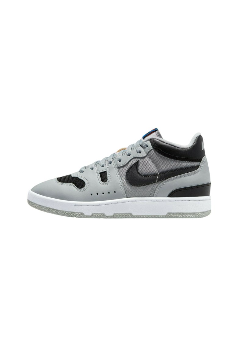 Gray sneaker with a mixed material design, featuring black accents, a perforated toe box, and a white rubber sole. Flat laces, padded collar.