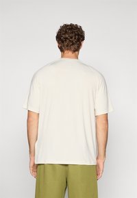 Champion TRAINING CREWNECK  - Camiseta deportiva - offwhite