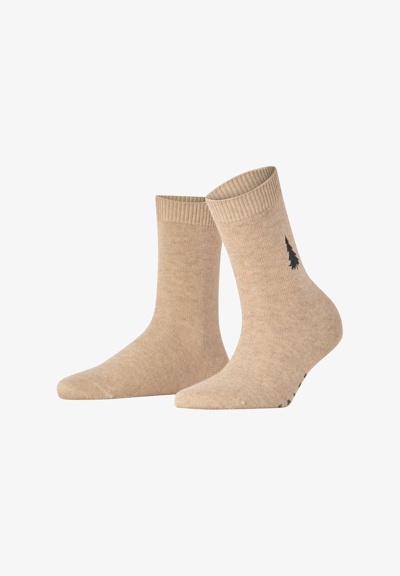 Beige Baumwollknöchelsocken mit gerippten Bündchen und einem kleinen schwarzen Baum-Logo an der Seite. Glatte Textur und schlichte Knöchellänge.