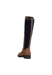 Bota de cuero marrón y ante azul marino de caña alta que presenta un panel lateral en contraste, punta redonda y un tacón bajo. Forro interior suave.