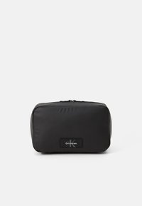 Black unisex pouch made of smooth nylon material. Rectangular shape, featuring a zip closure and a logo label on the front.