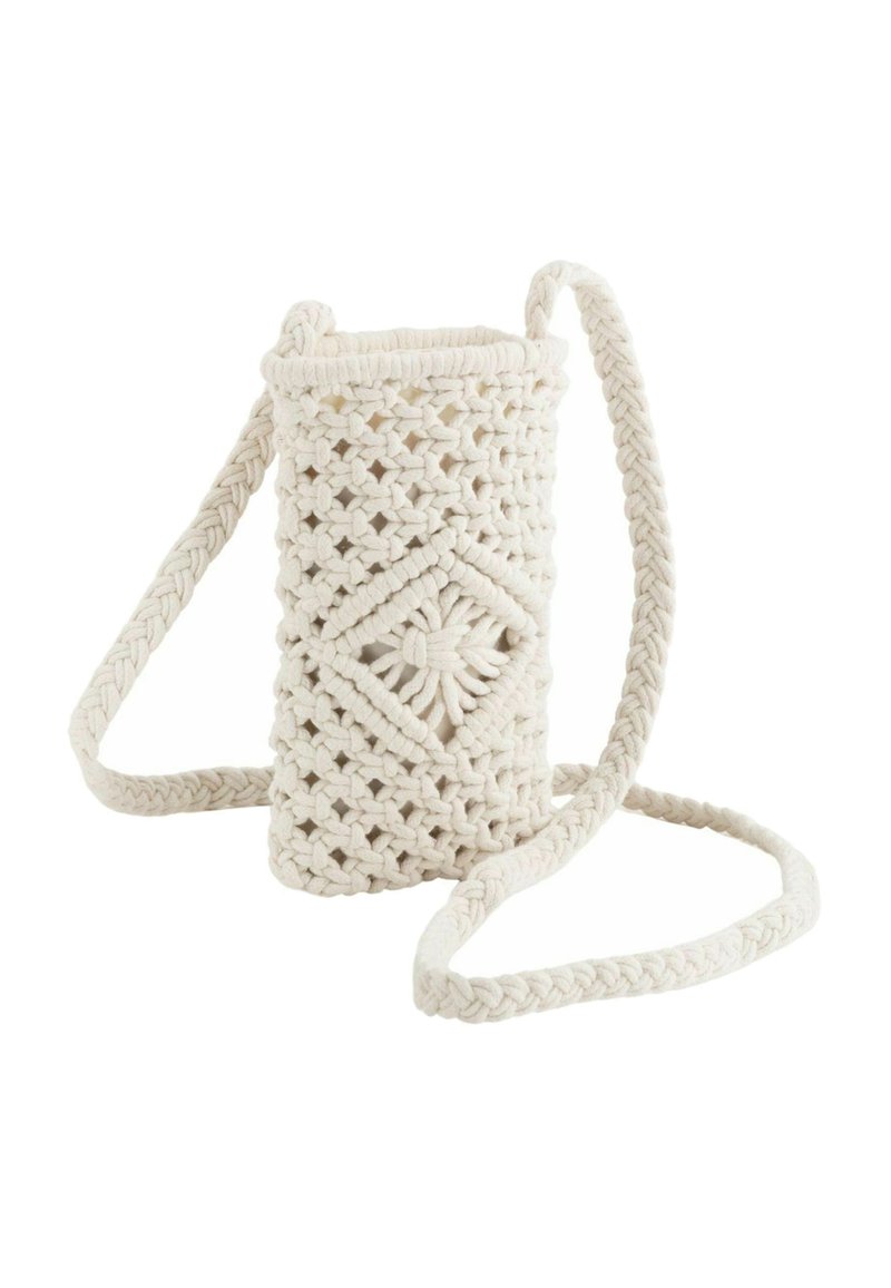 Crochet bag in off-white cotton, cylindrical shape, with a braided strap. Features intricate diamond patterns and a soft texture.