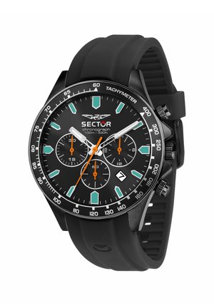 Orologio cronografo nero con indici verdi, lancette arancioni, lunetta tachimetrica, display della data e cinturino in gomma nero.