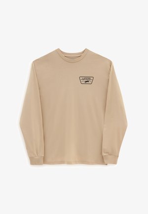 Chemise beige à manches longues et col rond avec un petit logo Vans noir et un graphisme de skateboard sur le côté gauche de la poitrine.