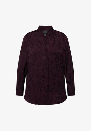 Blusa viola scuro con colletto alla cinese, chiusura frontale con bottoni, maniche lunghe e texture a motivo floreale.