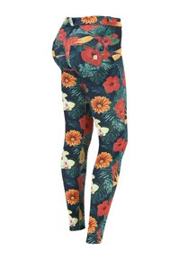 Leggings floreali con uno sfondo blu scuro decorato da fiori vivaci in rosso, arancione e verde. Vestibilità slim con tessuto elastico.