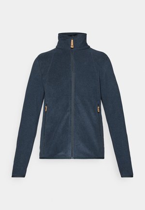 Navy blue zip-up jacket with a high collar, made of soft fabric; features contrasting light-brown zipper and pockets.