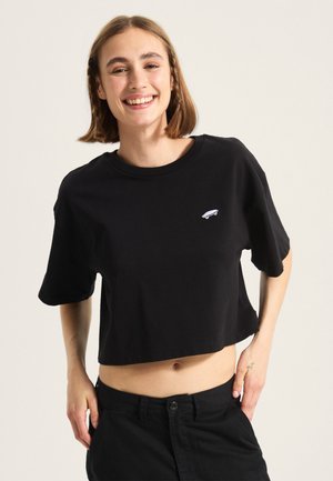 Black cropped t-shirt made of cotton with a round neckline and short sleeves, featuring a small white skateboard logo on the chest.