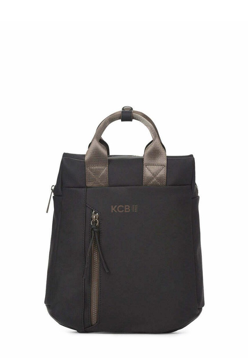 Bolso tote de nailon negro con asas cortas acolchadas, bolsillo exterior con cremallera y logo KCB en bronce. Forma cuadrada con textura suave.