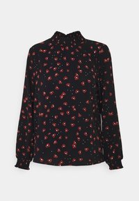 Blusa nera con maniche lunghe, scollo arricciato, caratterizzata da un motivo floreale rosso e bianco. Realizzata in un tessuto leggero e morbido.