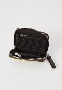 Zippered wallet with black fabric interior, yellow accent, multiple card slots, and a small zippered pocket for coins. Compact design.