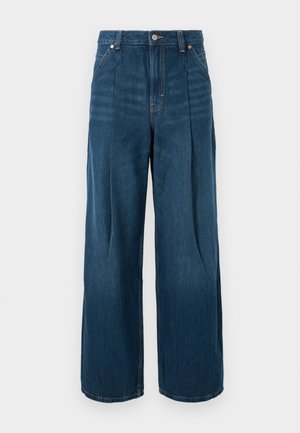 Donkere blauwe denim jeans met hoge taille en brede pijpen, voorzien van voorvouwen, riemlussen en een knoopsluiting.