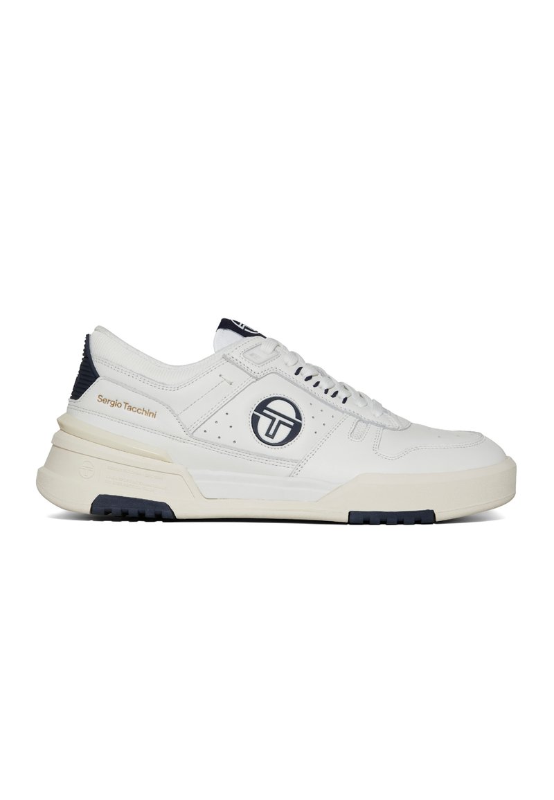 White leather sneaker with navy accents, featuring a perforated design, thick sole, and prominent logo on the side. Laces and padded tongue present.