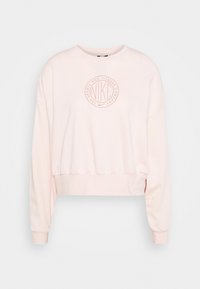 Light pink long-sleeve cropped sweatshirt with round neckline and circular Nike logo in soft orange on the chest.