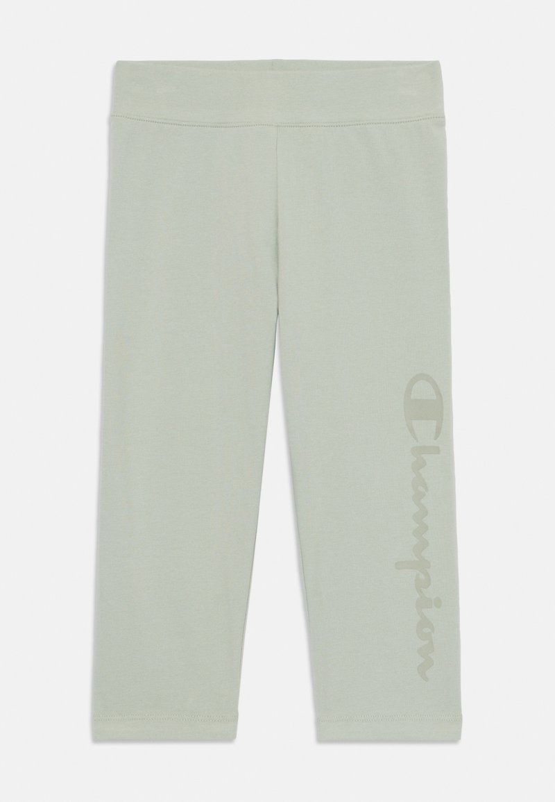 Light green leggings made of soft fabric, featuring a large, vertical Champion logo on the left side. Smooth, stretchy texture, mid-calf length.