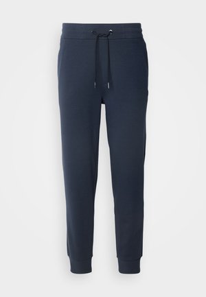 Pantaloni jogger blu navy realizzati in morbido tessuto, con vita elastica e cordino, gambe affusolate e polsini a costine.