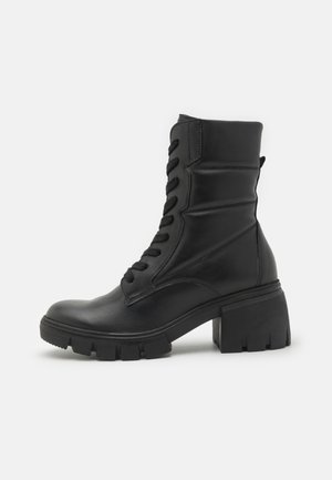 Lace-up ankle boots - schwarz